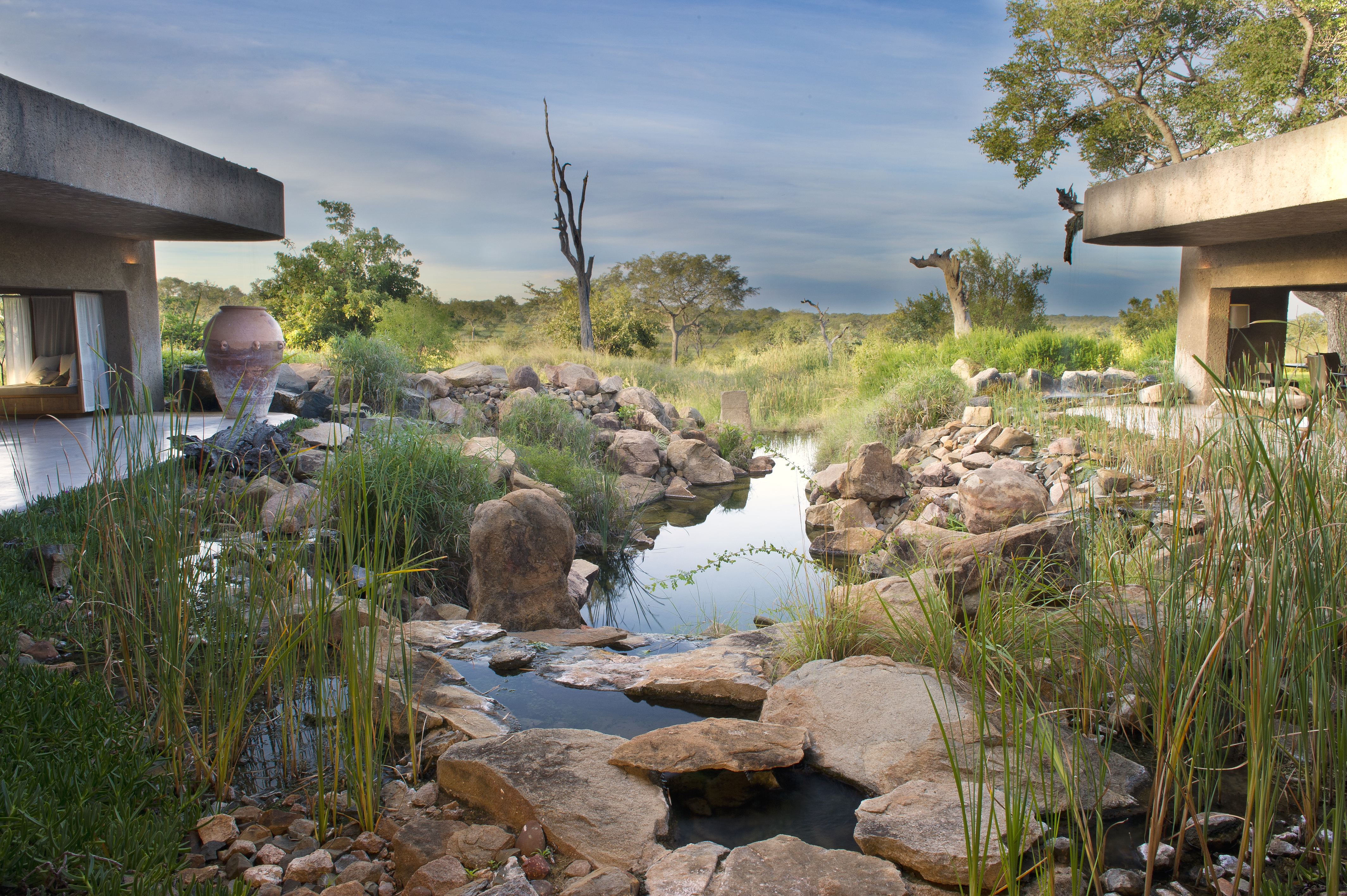 <p>The Sabi Sabi Earth Lodge features a stunning water feature entrance, which is designed to create a sense of tranquility and harmony as guests arrive at the lodge.</p>